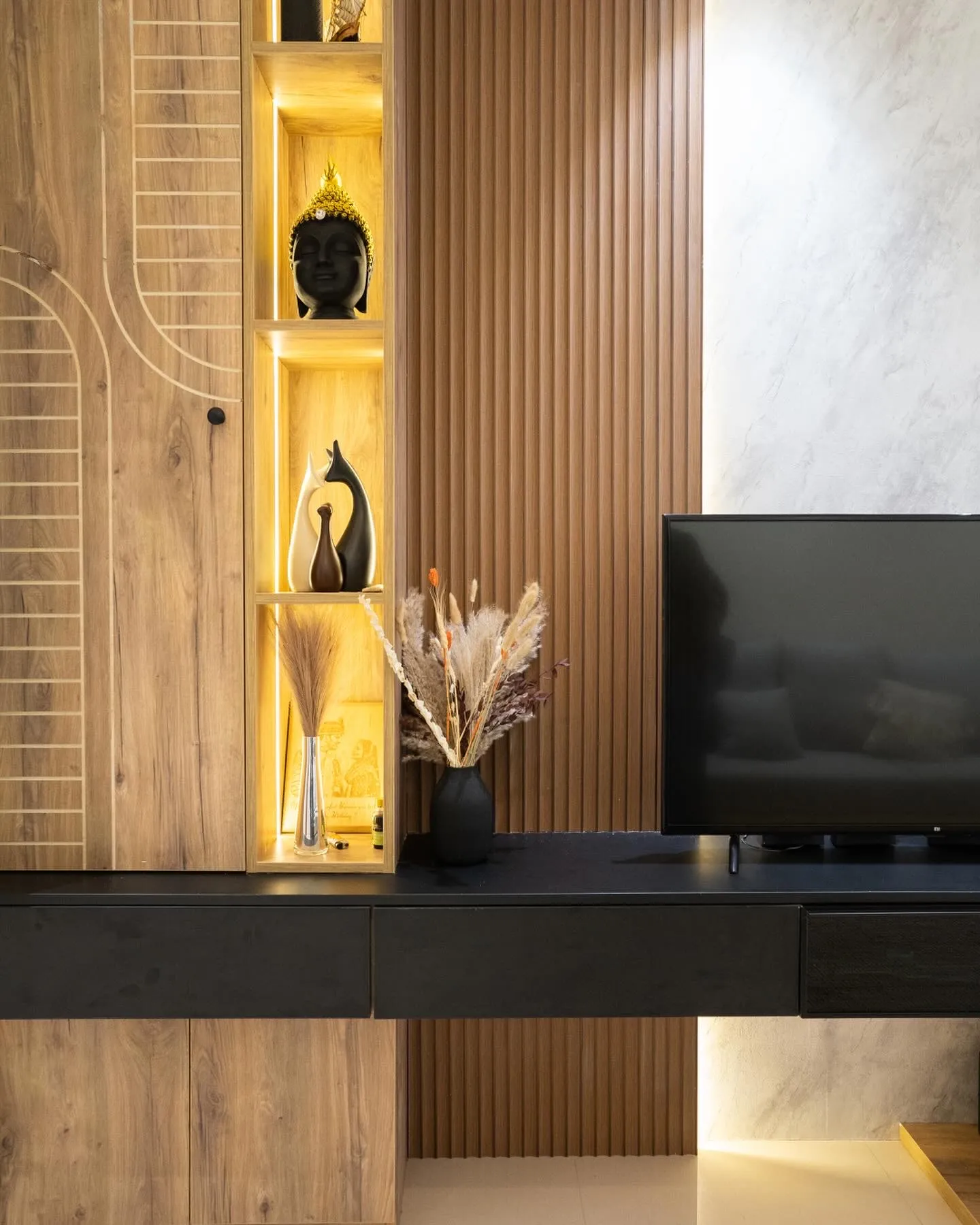 Oak-slat TV wall with lit display niche — The Aakar